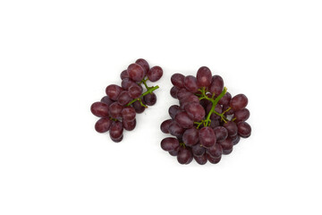 Red grapes with multiple seeds, in bunches, ready to eat.