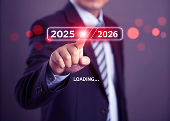A man is loading year 2025 to 2026 by placing his finger on a screen. He has made a new idea to develop his job or business. 