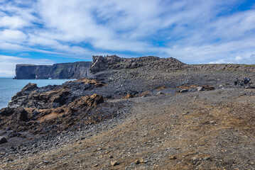 Distance view of Dyrholaey foreland located on the south coast of Iceland