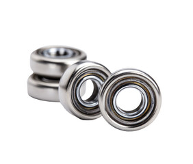 Close-up of several metallic bearings.  Stacked and angled, showing circular form