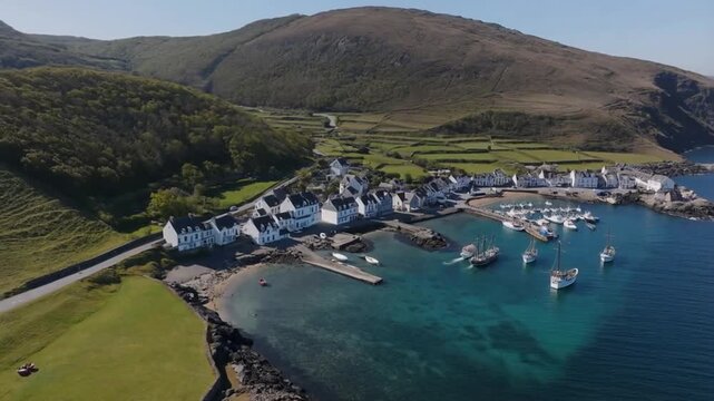 Aerial View of Coastal Village with Harbor and Sailing Boats