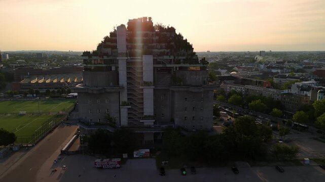 Aerial drone video of orbiting around the famous Bunker Building with newly greened roof in Hamburg