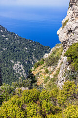 Dramatic landscape with a rock ravine with a seascape view from a mountain