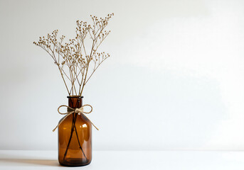 Fototapeta premium minimalist dried flower arrangement in brown ceramic vase