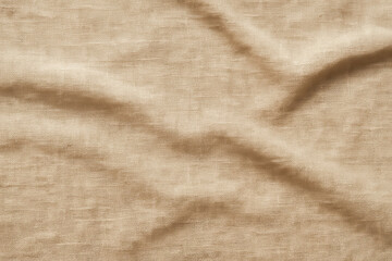 Beige linen fabric background with wrinkles and folds. Natural light brown textile texture for design, and rustic style concepts