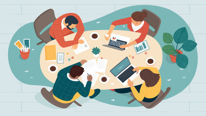 Top view of diverse team collaborating around a table, ideal for illustrating teamwork, brainstorming, and project collaboration.