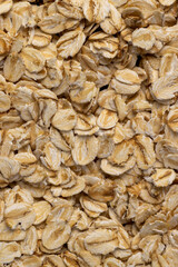 a large number of flakes from pressed oat grains, ingredients for cooking porridge