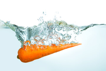 Fresh Carrot Splashing Into Clear Water with Dynamic Bubbles and Ripples