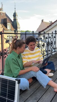 Collaborative working on rooftop with digital tablet
