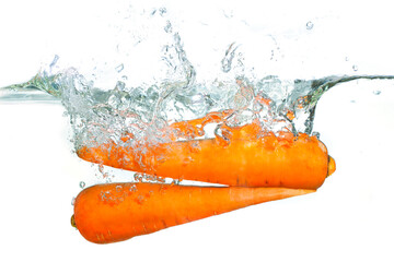 Fresh Carrots Splashed in Clear Water with Bubbles and Ripples