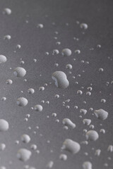 silver metal surface covered with water, wet silver metal painted to protect aluminum alloy and metals, close up