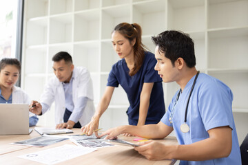 Medical team brainstorming having a meeting in conference room at hospital, Medical technology and health care concept.