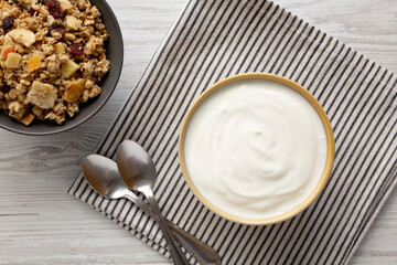 Organic Whole Fat Greek Yogurt in a Bowl, top view. Flat lay, overhead.