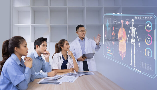 Medical team with human anatomy on technological digital holographic innovative having a meeting room, Medical technology and health care concept.