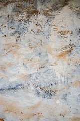 Faded, textured village house wall with peeling paint, an artistic background