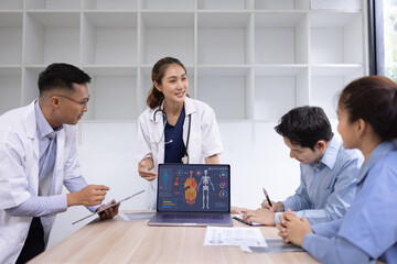 Medical team with laptop computer and examine x ray test results for treatment plans in a modern hospital, Healthcare and medical concept.