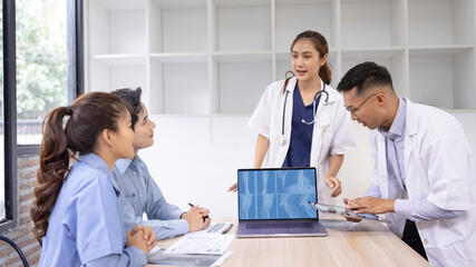 Medical team with laptop computer and examine x ray test results for treatment plans in a modern hospital, Healthcare and medical concept.