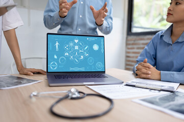 Medical team with laptop computer and examine x ray test results for treatment plans in a modern hospital, Healthcare and medical concept.