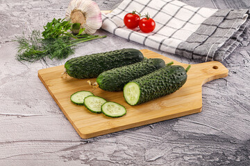 Raw green cucumbers with slices