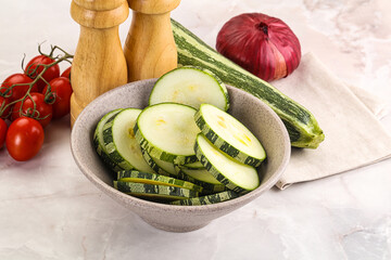 Raw green zucchini slices for cooking