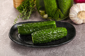 Homemade lighty salted cucumbers with herbs