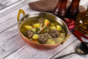 Soup with beef meatballs and vegetables