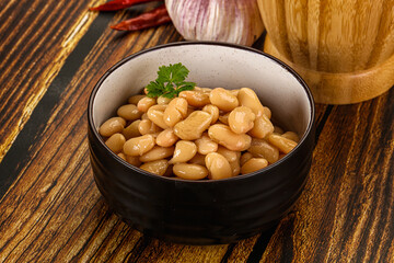 Baked white canned beans in the bowl