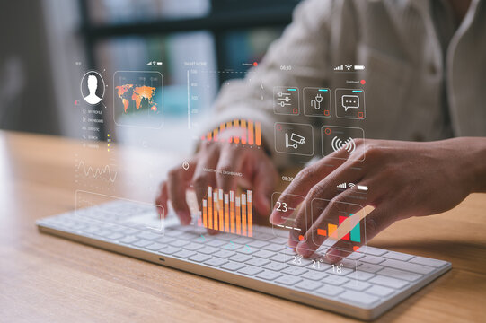 Man hands typing on wireless computer keyboard An analyst uses a computer and dashboard for data business analysis and Data Management System with KPI and metrics