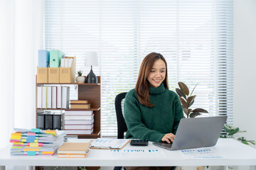 Focus and Fulfillment: An engaging professional woman, deeply engrossed in her work at a modern...