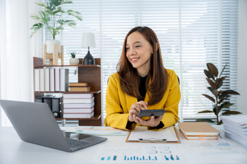 Focused Professional at Work: A bright, airy office setting showcasing a dedicated woman engrossed...