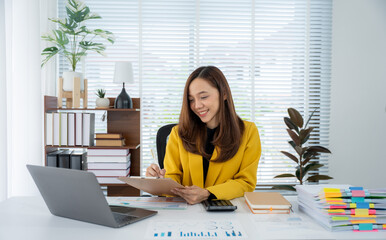 The Smiling Office Worker: A young woman, radiating positivity, works diligently at her desk. The...