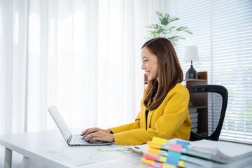 Modern Workplace: A professional, dressed in a cheerful yellow jacket, skillfully navigates a...