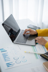 Analyzing Data: A focused professional engrossed in the analytical aspects, navigating data with...