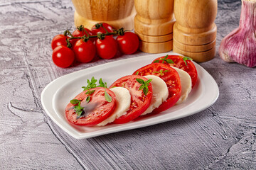Italian caprese salad with mozzarella, tomato and basil