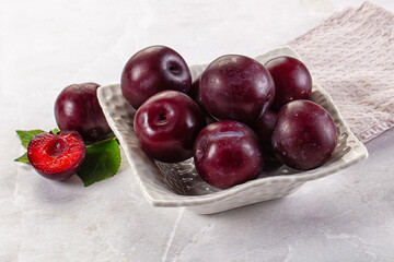 Raw ripe purple plum heap