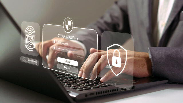 Digital Fortress: A close-up shot of a person’s hands diligently navigating a laptop’s keyboard, with superimposed graphical elements signifying cyber security, privacy, and robust data protection.