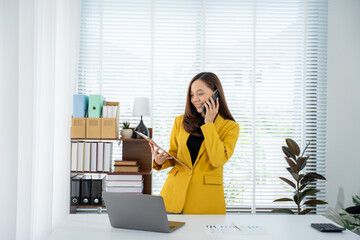 Elegant Office Professional: A sophisticated female executive, dressed in a bright yellow blazer,...