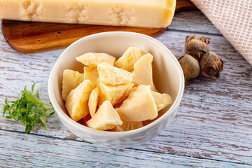Parmesan cheese pieces in the bowl