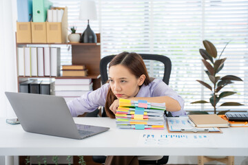 Overwhelmed at Work: A weary individual battles the demands of a bustling workspace, surrounded by...
