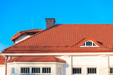 villa house south architecture living building front side facade white wall and windows and orange roof tile with chimney blue sky background space