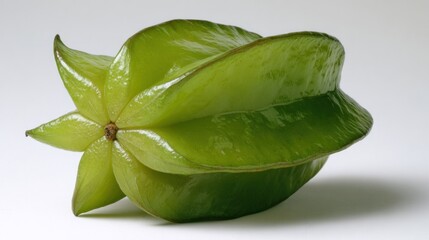 Fototapeta premium Bright green star fruit, whole, studio shot