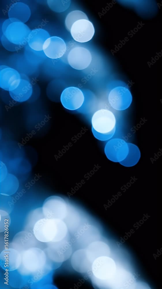 Poster abstract background of blue bokeh lights on a dark background