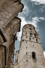 Low angle view of Romanesque tower and stone details at Jumieges Abbey in Normandy, France