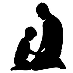 Silhouette of father and child praying together, captured in studio. Silhouette represents bond of love and faith between dad and son, kneeling in devotion.