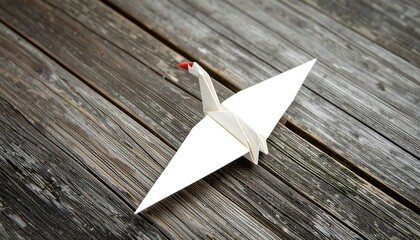 Origami crane on wooden surface