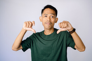 Disappointed Man Expressing Disapproval In Studio Portrait