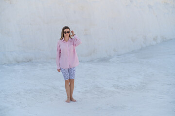 Exploring the Unique Terraces of Pamukkale Under Clear Skies During a Warm Day, Capturing the...
