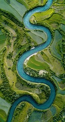 Obraz premium Winding river through vibrant green fields. Aerial view