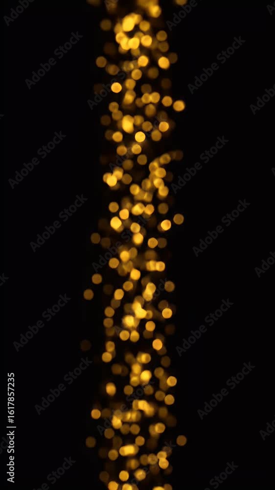 Poster abstract vertical bokeh lights displaying golden circles on black background