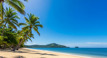 Obraz premium Idyllic tropical beach paradise with lush palm trees, pristine white sand, and a calm turquoise ocean under a clear blue sky.